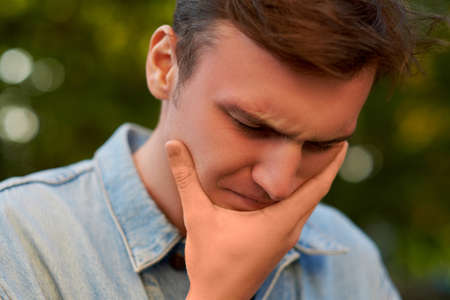Man with headache, migraine or stress. Help, troubles in communication, overworking concept