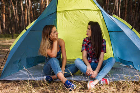 Women agreement. Tent friendship. Done work together. Morning jokesの写真素材