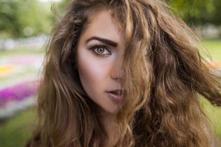 Female beauty closeup. Modern youth portrait. Pretty girl hair, tender look