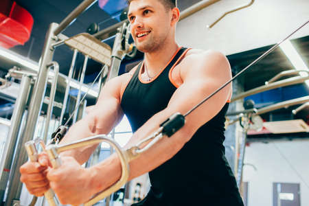 Power muscular smiling man gym sport concept. Lifestyle of athlete. Strength of will.