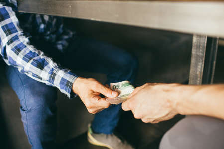 bribe corruption corporate business espionage illegal conceptの写真素材