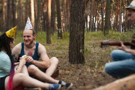 Friends guitar music picnic party nature concept. Traveler lifestyle. Hiking happy moments.の写真素材