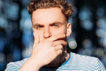 Pensive handsome hiker man nature concept. Traveler lifestyle. Time for reflections.の写真素材