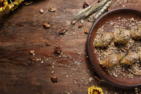 Food background. Baklava on a rustic plate. Turkish dessert conceptの写真素材