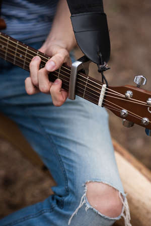 Musician romantic lifestyle guitar concept. Stroller man at the nature. Artist instruments.の写真素材