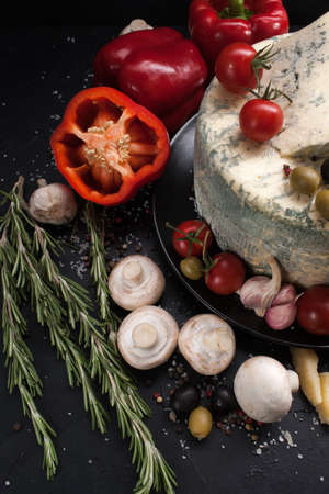 food photography art. gourmet blue cheese vegetables spices assortment mix conceptの写真素材
