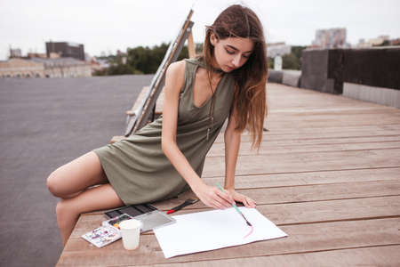 Artist inspiration inks urban roof concept. Working process. Creating beautiful painting. Great view.の写真素材