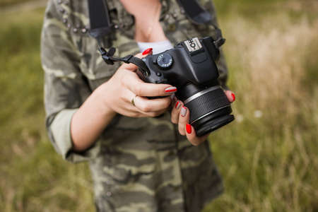 Photographer hands work backstage concept. Photo creating process. Unity with nature.の写真素材