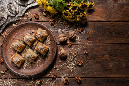 Food background. Baklava on a rustic plate. Turkish dessert conceptの写真素材