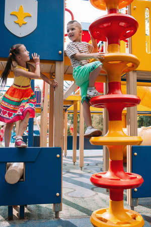 Little fidget children get fun in the park. Family lifestyle. Activity leisure.の写真素材