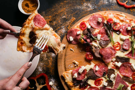 food photography art. pizza serving at restaurant. leisure conceptの写真素材