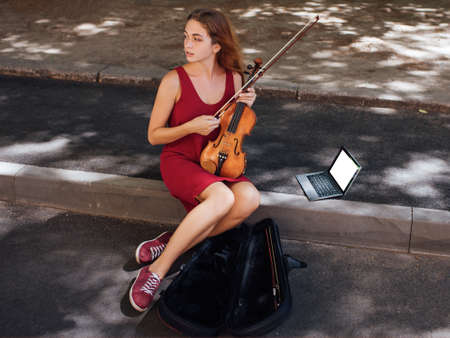 street musician performance. musical art student lifestyle. making money hobby conceptの写真素材