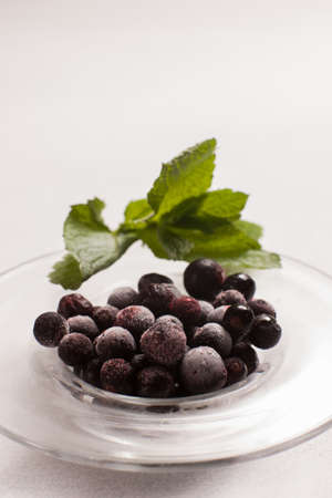 frozen black currant. organic fruit berries. healthy vegan. food photography art conceptの写真素材