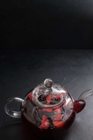 glass teapot background helalthy organic fruit tea conceptの写真素材