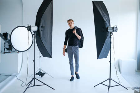 backstage self-confident man equipment workplace photo studio concept. Photography of fashion look.の写真素材