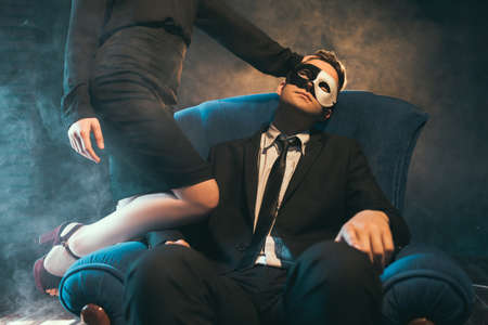 Business couple engage in sex games as a means of relaxation and unwinding. Woman domination. Secret life conceptの写真素材