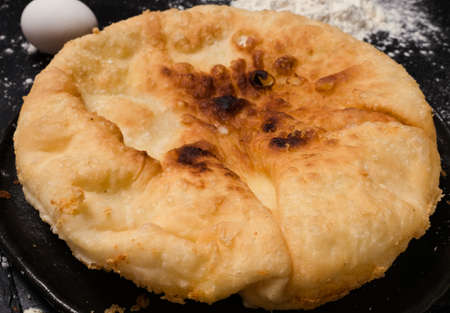 nourishing imeretian khachapuri recipe. fatty delicious unhealthy food. georgian cuisineの写真素材