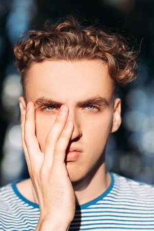 Mysterious handsome hiker man nature concept. Traveler lifestyle. Secret in his eyes.の写真素材