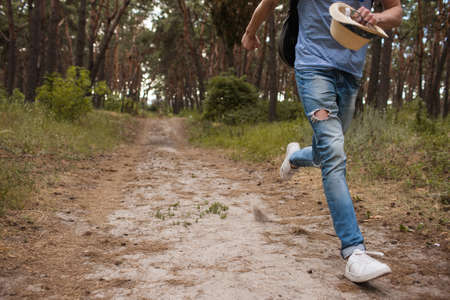 Hiking running fashion man look nature outfit concept. Active lifestyle. Great view.の写真素材