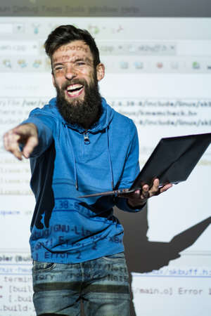 Elocution or speech craft courses. Bearded young male orator laughing and interacting with someone...