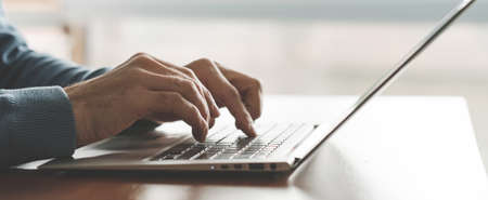 Programmer at work. Creating apps. Man coding on the laptop. Software developer. IT sphere.の写真素材