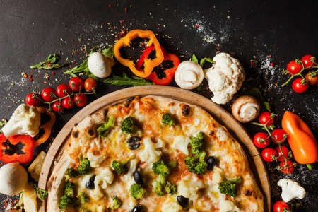 Vegan cauliflower broccoli pizza. Diet dish with lots of vegetable proteins for healthy nutrition...