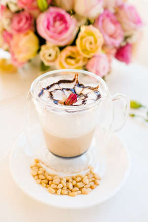 hot and delicious cappuccino coffee concept. restaurant drinks. professional barista work.の写真素材