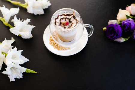 hot and delicious cappuccino coffee dark background concept. restaurant drinks. professional barista work.の写真素材