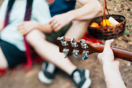 Friends picnic guitar music nature concept. Traveler lifestyle. Hiking happy moments.