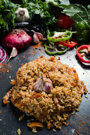 Traditional Uzbek cuisine plov dish vegetable background. Healthy food eating and proper nutrition...