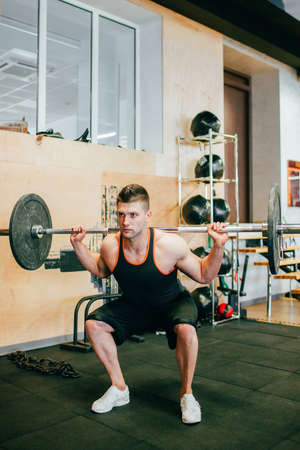 Hard gym workout body-building man concept. Lifestyle of athlete. All for the    of achieving the goal.の写真素材