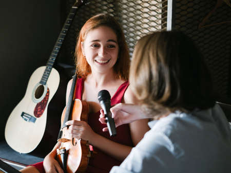 musician giving interview. famous person celebrity lifestyle. talent show publicity conceptの写真素材