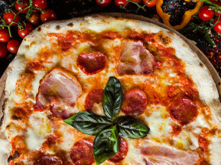 Pepperoni pizza. Fattening and delicious meal with lots of meatの写真素材
