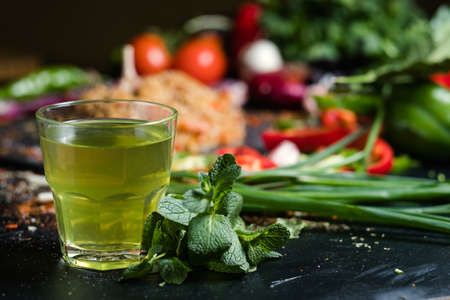 cold mint herbal green tea in a glass. Refreshing beverage. Healthy lifestyle, detox drink