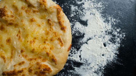 Mingrelian or megruli khachapuri is traditional Georgian cuisine meal. Baked bread with cheese filling. National pastry snackの写真素材