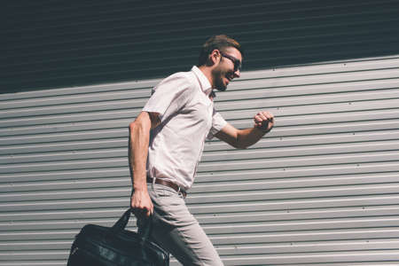 time management failure. stressed businessman running late to a meeting. hurry rush business conceptの写真素材
