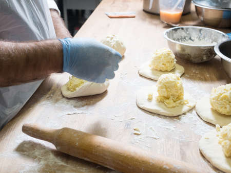 Khachapuri with cheese preparing. National Georgian cuisineの写真素材