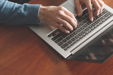 speed typing training. Man hands on the laptop keyboard. Improving office skills