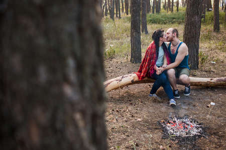 Couple love nature picnic bonfire forest concept. Happy family together. Travel lifestyle.の写真素材