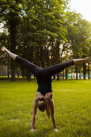gymnastic exercises training sport outdoor concept. exercise to develop flexibility. active lifestyle.の写真素材