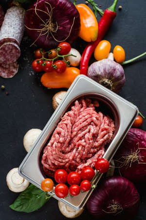Assortment of homemade meat products. Italian salami recipe. Cooking with fresh ingredients concept