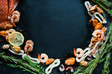 Seafood mix on dark background. Asian cuisine. Healthy eating. Diet food conceptの写真素材