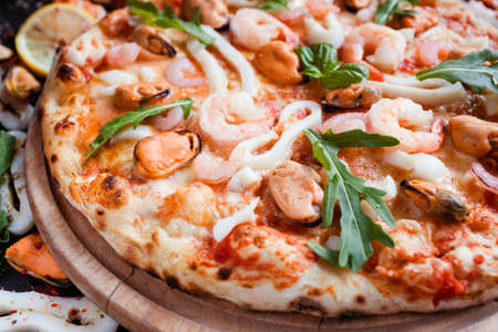 Seafood pizza. Delicious italian meal. Fast and tasty dinner conceptの写真素材