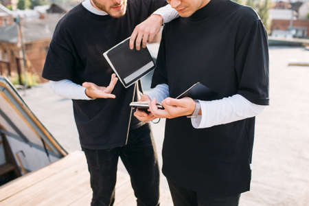 Surfing the web for information. Modern technology. Man using tablet. Students education homework conceptの写真素材