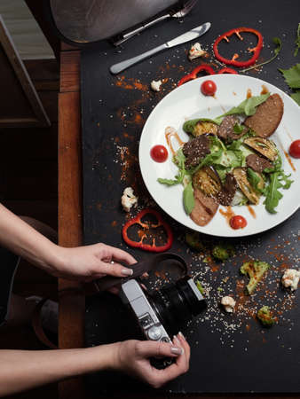 photographer woman has a delicious break. backstage of photoshoot. active lifestyle. proper nutrition.の写真素材
