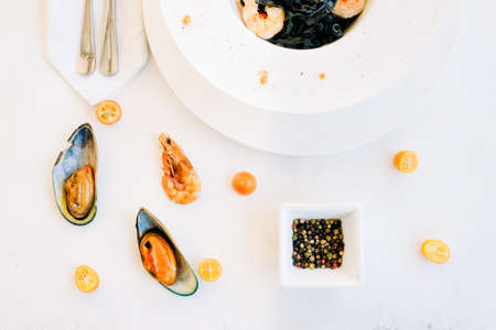 restaurant seafood black pasta recipe concept. traditional kitchen. national cuisine. delicious delicacy.の写真素材