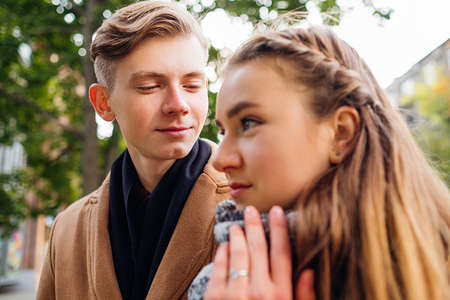 Tender love. Boyfriend admires his girlfriend. Affectionate cute relationshipの写真素材