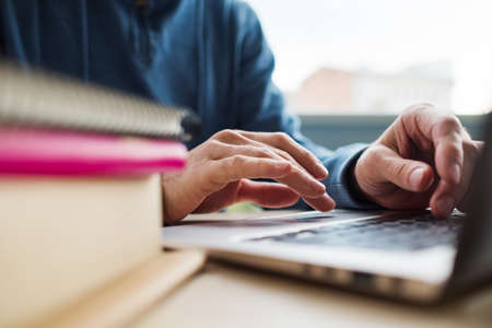 Modern education - get a degree online. Learning your profession on the internet. Man is studying...