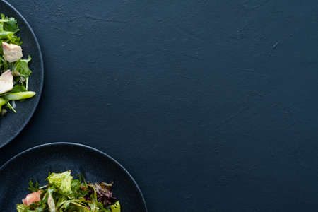 salad plate on blue background. Vegetarian food. Wholesome organic nutritionの写真素材