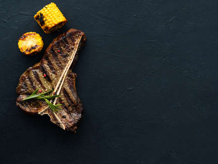 american pork chop steak on dark background. Barbecued and seasoned delicious quality meat dish.の写真素材